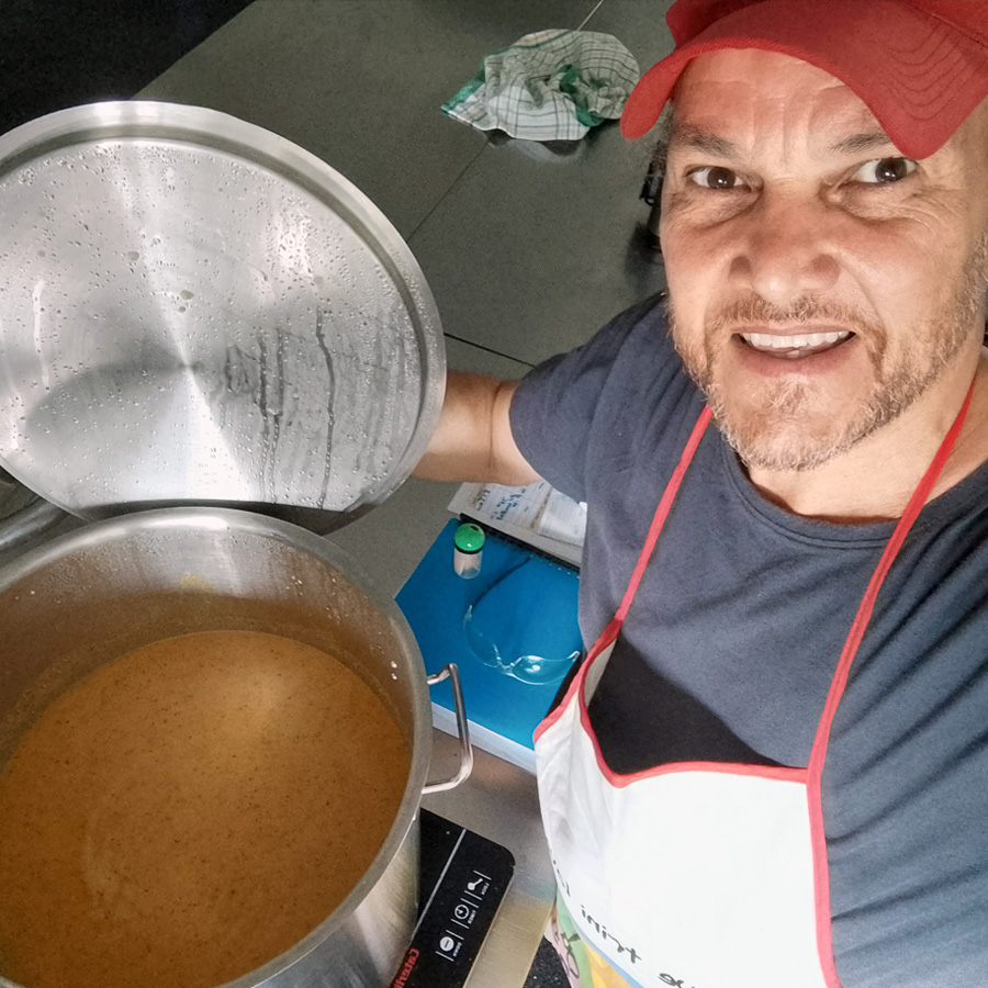 Adrian in the kitchen making a fresh batch of Love Pepper Sauce